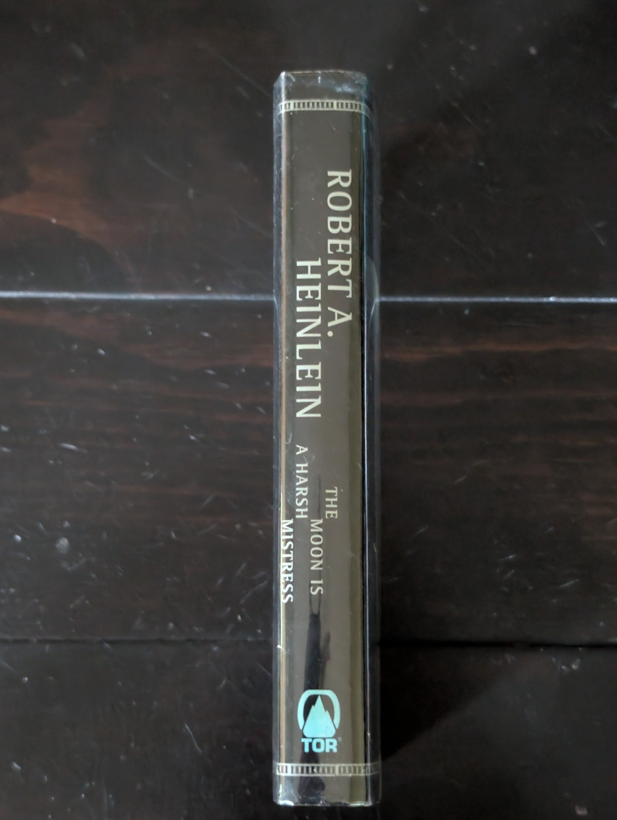 Moon Is a Harsh Mistress by Robert A. Heinlein (1996, Hardcover) -JD